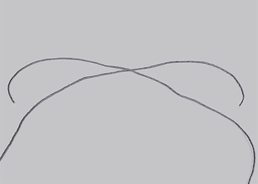 Closeup of grey cords crossing